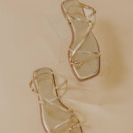 The Lucia Faux Leather Metallic Sandal in Gold