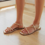 The Lucia Faux Leather Metallic Sandal in Gold